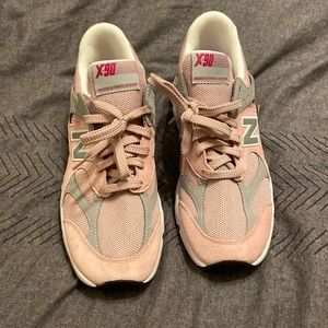 Grey/Pink New Balance shoe.